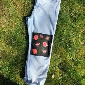 Boyfriend jeans with galaxy on left knee